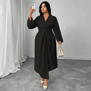 Elegant black long-sleeve V-neck dress with slim waist design and irregular cut