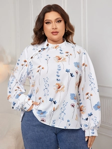 Detail of floral long sleeve blouse with side button collar and blue flower pattern