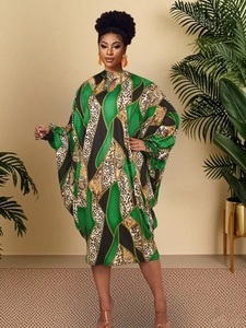 Detail of batwing sleeve maxi dress with green geometric blocks and leopard print