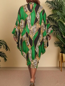 Detail view of batwing sleeve maxi dress with geometric print and back cutout