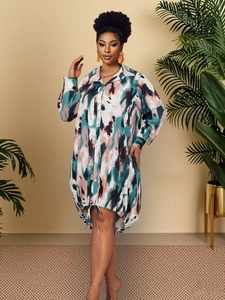 Detail of loose-fit long sleeve polo dress with abstract tie-dye print and drawstring hem