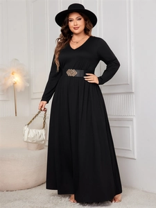 Detail of plus size black long sleeve maxi dress with metallic buckle waist belt