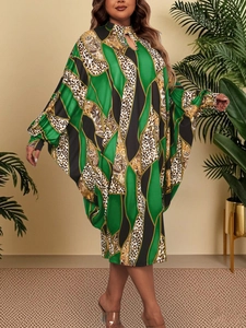 Detail of batwing sleeve kaftan dress with baroque and leopard print pattern