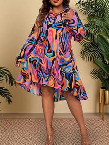 Close-up of a colorful abstract print shirt dress with high-low hemline and polo collar
