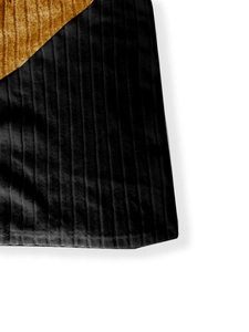 Detail of black vertical striped fabric stitched with brown corduroy panels on the cardigan
