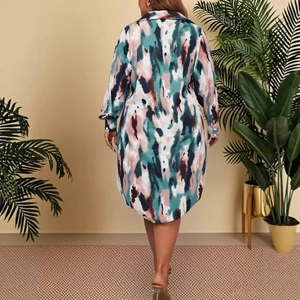 Women's long sleeve polo dress featuring abstract green and pink ink camouflage print