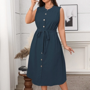 Elegant navy blue sleeveless midi dress with buttons and waist tie in a modern home setting