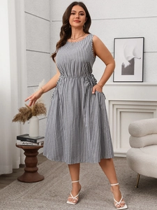 Detail view of sleeveless midi dress with grey and white stripes and side pockets