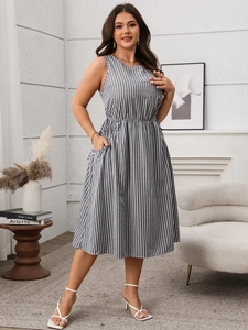 Detail of grey and white striped sleeveless maxi dress featuring functional side pockets