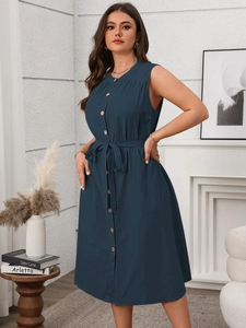 Detail of dark blue sleeveless midi dress with wooden buttons and waist tie belt
