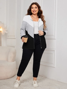 Detail of color-block striped hoodie with white, grey and black panels and ribbed cuffs
