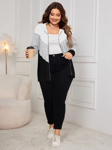 Detail of three-color oversized hooded cardigan with zipper and matching black slim pants