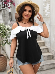 Detail of off-shoulder ruffled sleeves and bow tie neckline on black summer top