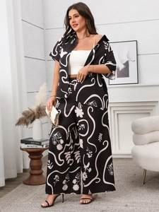 Detail of plus size floral print set with short sleeve shirt and wide leg trousers