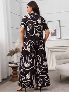Detailed back view of women's floral print short sleeve shirt and wide leg pants set