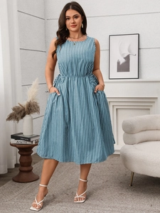 Detail of blue and white striped sleeveless summer dress with side pockets and elastic waist