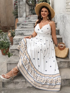Detailed view of bohemian white dress featuring geometric embroidery and diamond prints