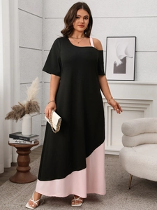Detail of elegant two-tone asymmetrical stitching on a chic black and pink maxi dress