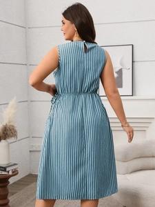 Detail of blue and white striped sleeveless midi dress showing waistline and back button
