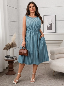 Detailed view of the elastic waist and blue-white striped fabric on the summer dress
