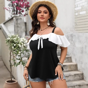 Off-shoulder black and white blouse with ruffle sleeves and bow tie detail