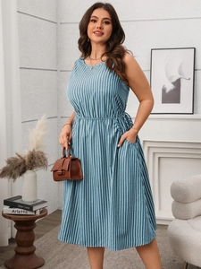 Detail of sleeveless striped midi dress with elastic waist and practical side pockets