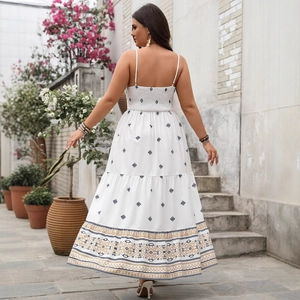 Bohemian white sundress with blue diamond patterns and ethnic embroidery on the hemline