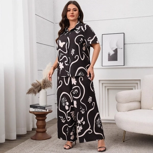 Women's plus size two-piece set with black butterfly print shirt and wide-leg trousers
