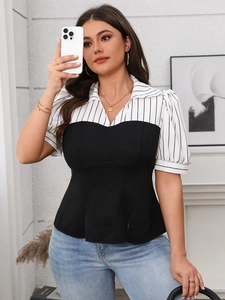 Detailed shot of striped patchwork short sleeve top with corset style waist design