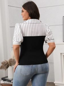 Close-up back view of striped short sleeve shirt with puff sleeves and color blocking