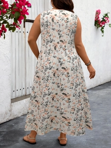 Detailed back view of a sleeveless floral maxi dress with an A-line cut in soft light tones