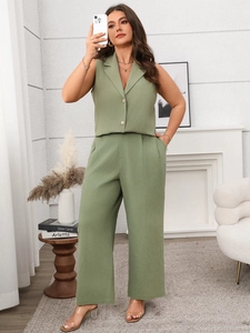 Detail of sage green linen-texture vest and high-waist wide-leg trousers set for women