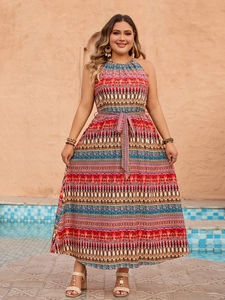 Detail of bohemian halter neck dress with geometric print and matching waist belt