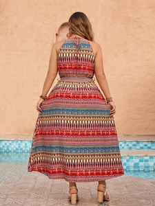 Back view of a bohemian halter neck maxi dress with vibrant geometric prints by a pool