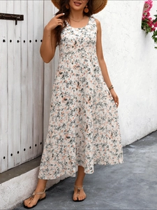 Detail of a floral print sleeveless maxi dress featuring a high waist and summer beach style