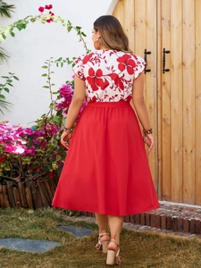 Back view of a floral short-sleeve top and red A-line midi skirt set for women