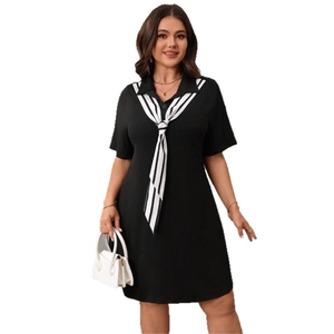 Short sleeve polo dress in black with striped collar and A-line skirt silhouette