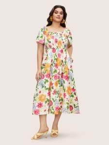 Detail of square neck floral maxi dress featuring smocked bodice and puff sleeves