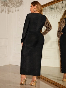 Detailed mirror view of a bodycon dress with glitter fabric and zebra print sleeves