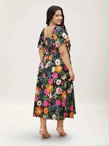 Detail of floral midi dress featuring a square neckline and a comfortable smocked back