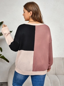 Detail view of oversized color block knit sweater with ribbed cuffs and drop shoulder design