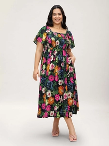 Detail of square neck and smocked bodice on a plus size floral print summer maxi dress
