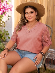 Detail of V-neckline with crochet lace trim and hollow sleeve on pink plus size t-shirt
