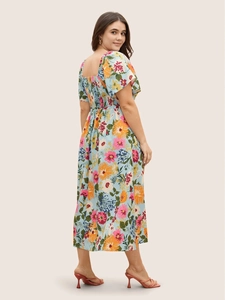 Detail of smocked elastic back and puff sleeves on floral summer maxi dress