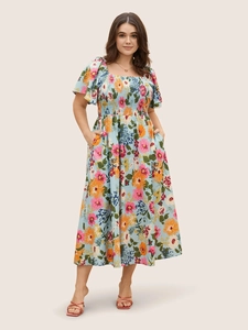Detailed view of square neckline and smocked bodice on the floral summer maxi dress