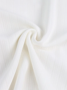 Detailed macro shot of white fabric with vertical stripes and elegant soft texture