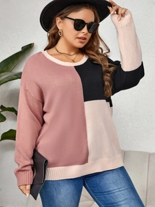 Detailed knit texture of pink and black color block sweater with ribbed cuffs