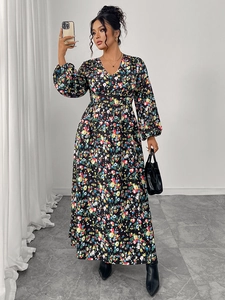 Close-up of V-neck floral print dress with long lantern sleeves and a high waist line