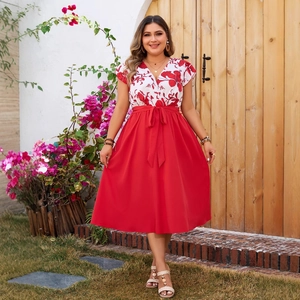 Plus size summer dress with V-neck floral print top and red flared skirt with waist bow