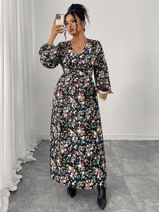 Detail view of the floral maxi dress featuring a classic V-neck and elegant puff sleeves